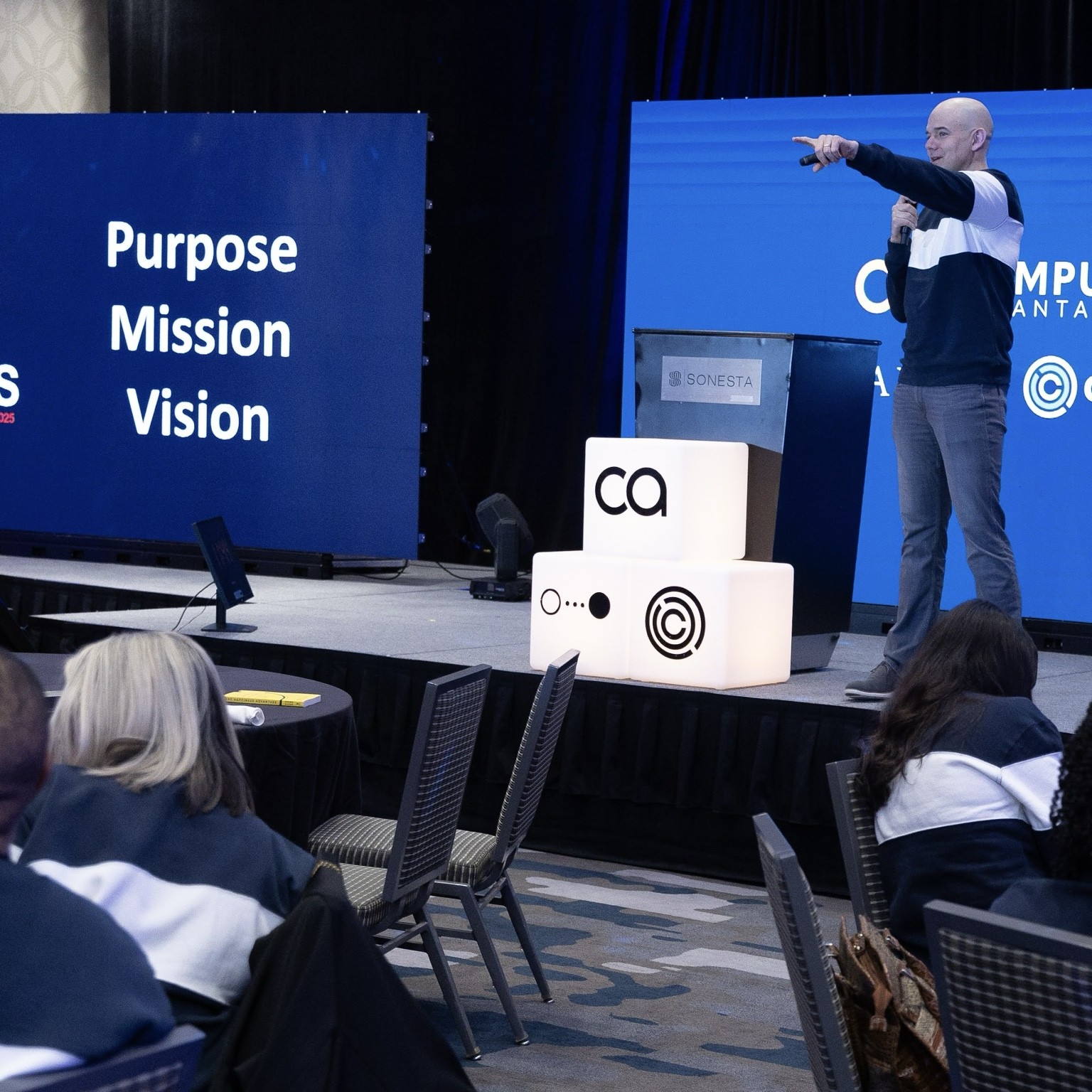 Dan speaking to a room during a leadership session